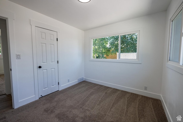 875 N 50 W, Orem, UT 84057 - unfurnished bedroom featuring dark colored carpet and baseboards