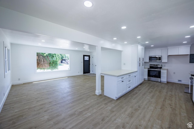 875 N 50 W, Orem, UT 84057 - kitchen featuring stainless steel appliances, open floor plan, recessed lighting, light countertops, and light wood-type flooring