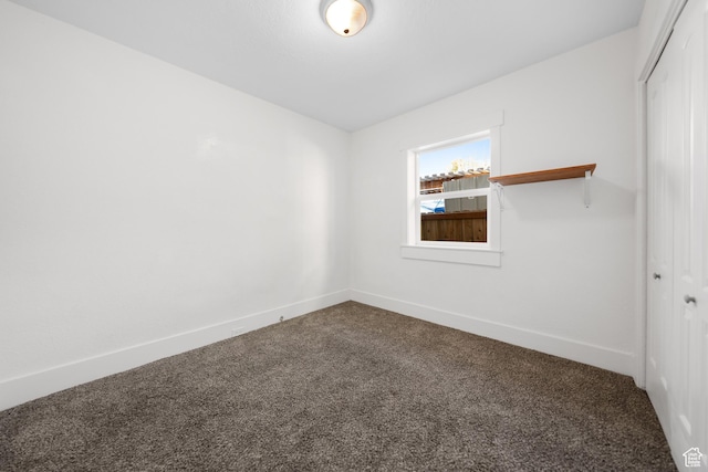 726 E 29th S, Ogden, UT 84403 - unfurnished room featuring dark colored carpet and baseboards