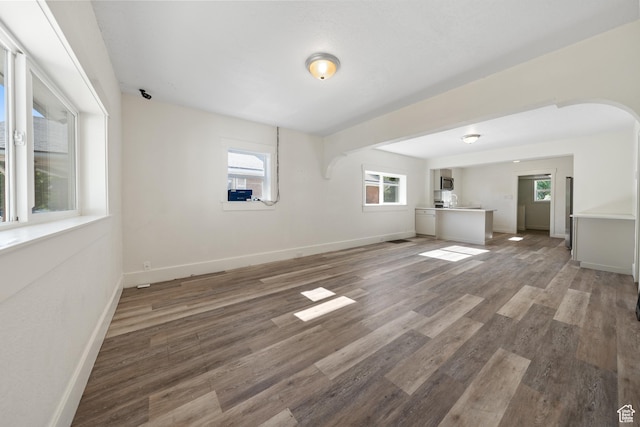 726 E 29th S, Ogden, UT 84403 - unfurnished living room with wood finished floors and arched walkways