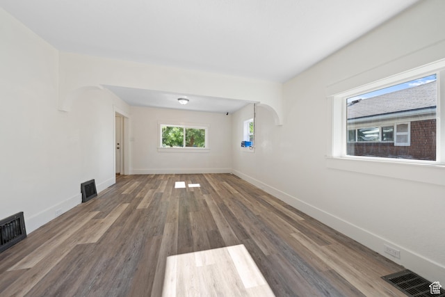 726 E 29th S, Ogden, UT 84403 - unfurnished living room with wood finished floors and arched walkways