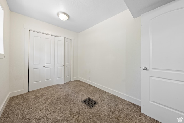 726 E 29th S, Ogden, UT 84403 - unfurnished bedroom with carpet floors and a closet