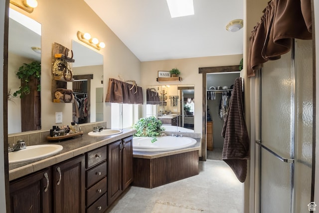 5375 N Canal Rd, Lapoint, UT 84039 - full bath featuring a garden tub, double vanity, a shower, a skylight, and a closet
