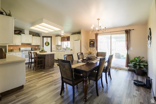 5375 N Canal Rd, Lapoint, UT 84039 - dining space with a chandelier and wood finished floors