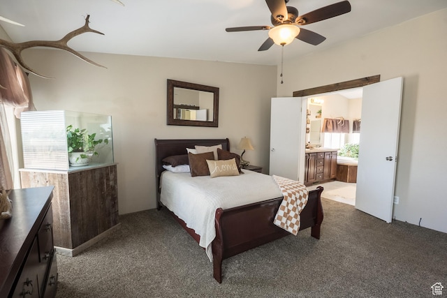 5375 N Canal Rd, Lapoint, UT 84039 - bedroom featuring dark carpet, ensuite bath, and a ceiling fan