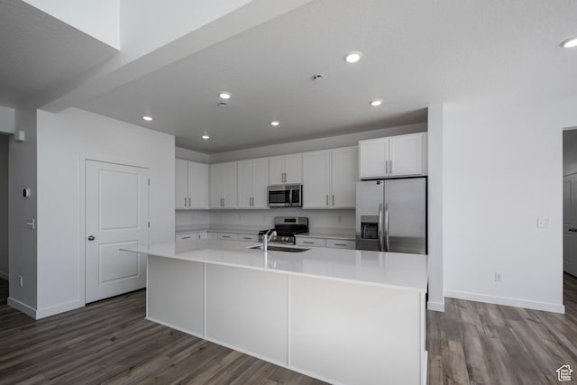 1844 E Bison Dr N Unit B229, Eagle Mountain, UT 84005 - kitchen with stainless steel appliances, dark wood finished floors, light countertops, white cabinets, and recessed lighting