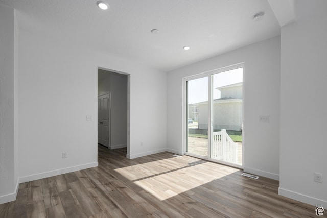 1844 E Bison Dr N Unit B229, Eagle Mountain, UT 84005 - unfurnished room with wood finished floors and recessed lighting