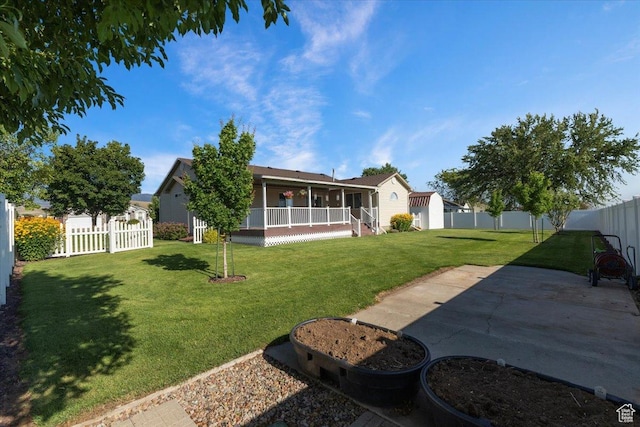 845 S 1150 E, Preston, ID 83263 - rear view of house with a fenced backyard, covered porch, and a patio