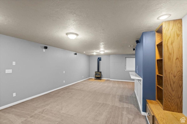 845 S 1150 E, Preston, ID 83263 - finished basement with a wood stove, a textured ceiling, and light colored carpet