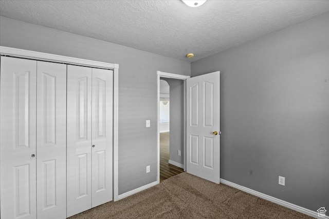 845 S 1150 E, Preston, ID 83263 - unfurnished bedroom with a closet, carpet floors, and a textured ceiling