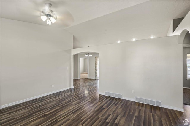 845 S 1150 E, Preston, ID 83263 - spare room with arched walkways, dark wood finished floors, a ceiling fan, and vaulted ceiling