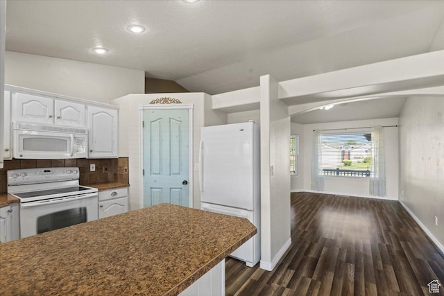 845 S 1150 E, Preston, ID 83263 - kitchen featuring white appliances, white cabinets, dark wood finished floors, lofted ceiling, and dark countertops