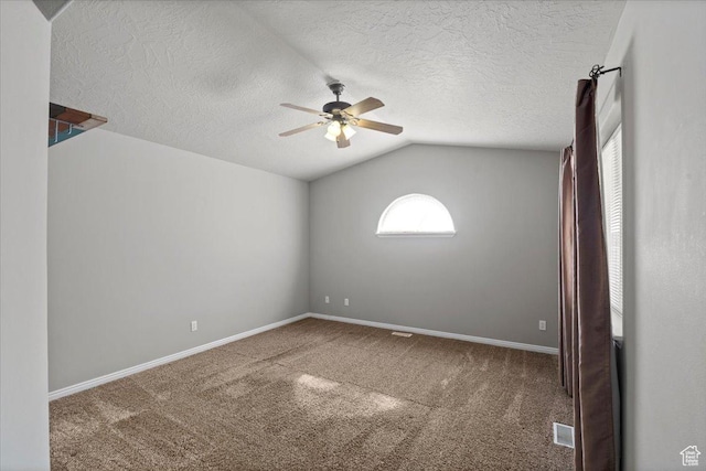 845 S 1150 E, Preston, ID 83263 - spare room featuring ceiling fan, lofted ceiling, carpet flooring, and a textured ceiling