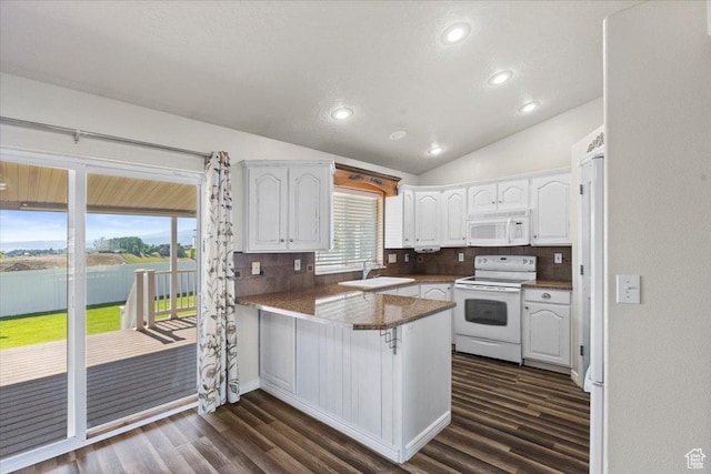 845 S 1150 E, Preston, ID 83263 - kitchen with white appliances, a peninsula, white cabinets, dark wood-type flooring, and lofted ceiling