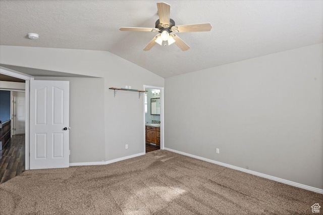 845 S 1150 E, Preston, ID 83263 - unfurnished bedroom with carpet, vaulted ceiling, a textured ceiling, connected bathroom, and a ceiling fan