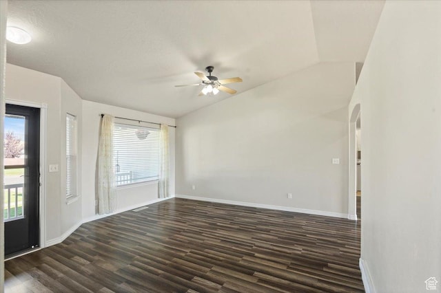 845 S 1150 E, Preston, ID 83263 - spare room featuring ceiling fan, healthy amount of natural light, dark wood-style flooring, and arched walkways