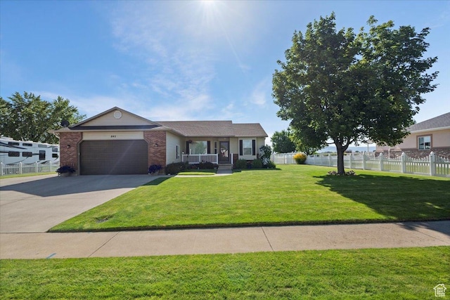 845 S 1150 E, Preston, ID 83263 - single story home with covered porch, an attached garage, brick siding, and concrete driveway