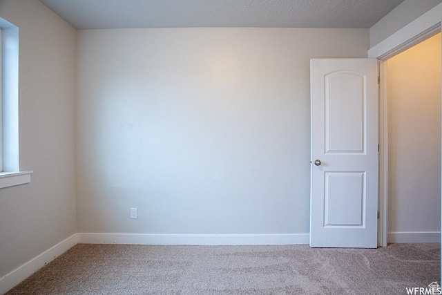 124 N Peach St, Santaquin, UT 84655 - carpeted spare room with baseboards