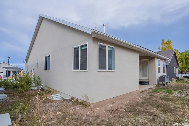 124 N Peach St, Santaquin, UT 84655 - view of property exterior featuring stucco siding