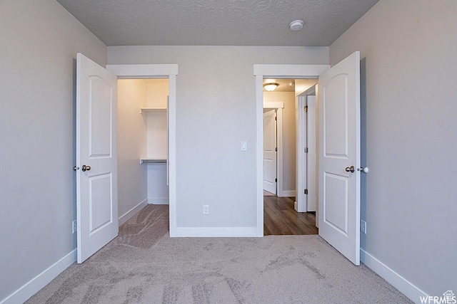 124 N Peach St, Santaquin, UT 84655 - unfurnished bedroom with carpet flooring and a textured ceiling