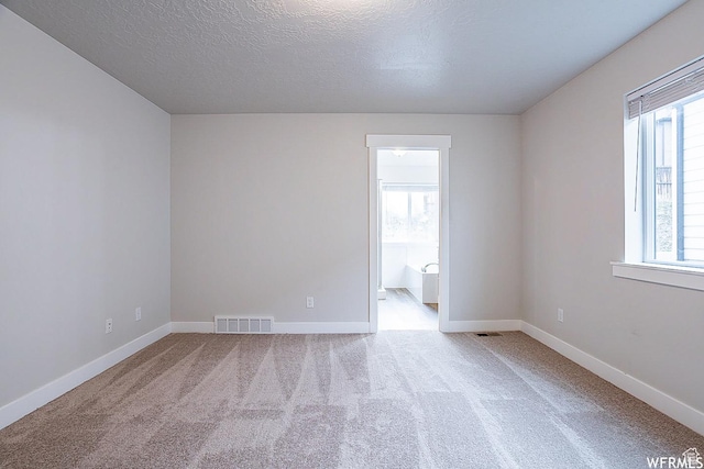 124 N Peach St, Santaquin, UT 84655 - carpeted empty room with baseboards and a textured ceiling