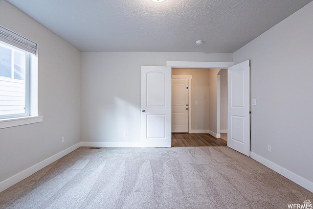 124 N Peach St, Santaquin, UT 84655 - carpeted spare room featuring a textured ceiling and a smoke detector