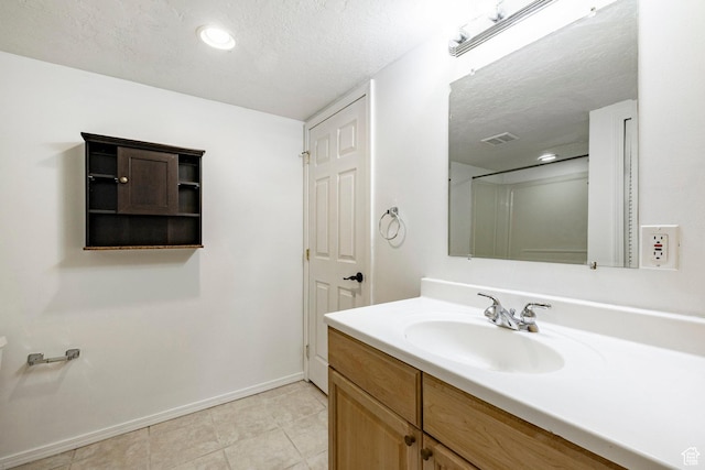 902 W 4200 S, Riverdale, UT 84405 - bathroom featuring vanity, tile patterned flooring, a textured ceiling, and recessed lighting