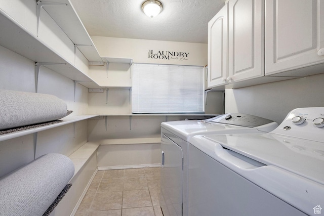 902 W 4200 S, Riverdale, UT 84405 - laundry area with cabinet space, washing machine and clothes dryer, light tile patterned flooring, and a textured ceiling