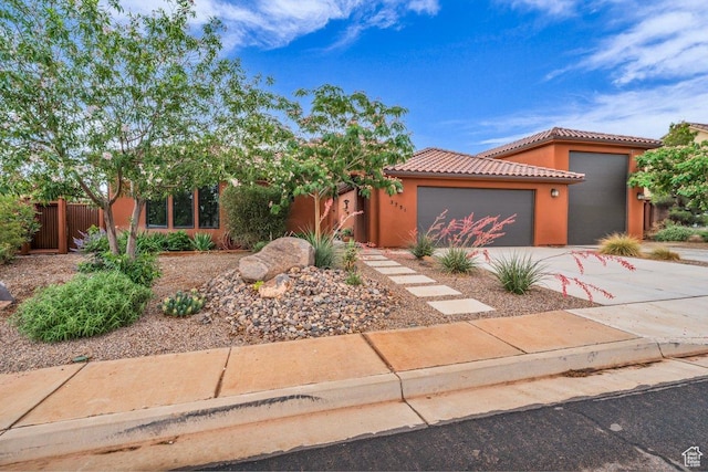 2751 S 3970 W, Hurricane, UT 84737 - view of front of property featuring a garage, concrete driveway, stucco siding, and a tiled roof