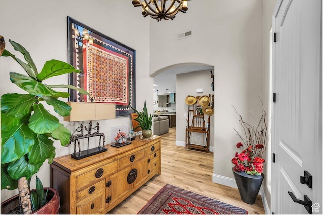 2751 S 3970 W, Hurricane, UT 84737 - foyer with arched walkways, light wood-style flooring, a chandelier, and a high ceiling