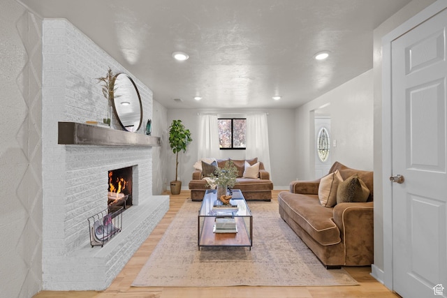 2111 W 5800 S, Roy, UT 84067 - living room featuring wood finished floors, a fireplace, and recessed lighting