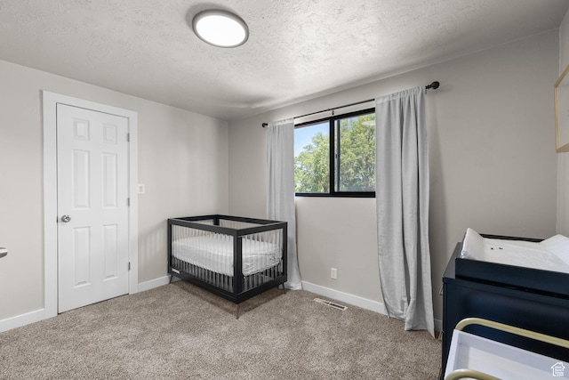 2111 W 5800 S, Roy, UT 84067 - carpeted bedroom featuring a textured ceiling and a crib