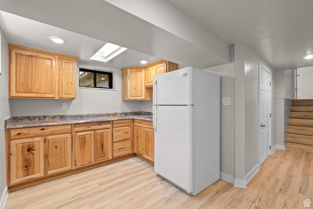 2111 W 5800 S, Roy, UT 84067 - kitchen with freestanding refrigerator, light wood-type flooring, recessed lighting, and light brown cabinetry