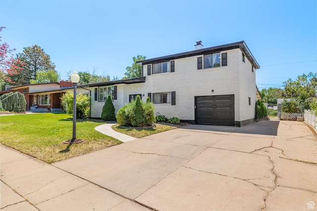 2111 W 5800 S, Roy, UT 84067 - split level home featuring driveway, brick siding, a garage, and a chimney