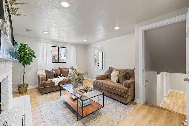 2111 W 5800 S, Roy, UT 84067 - living area featuring a fireplace, light wood-type flooring, and recessed lighting