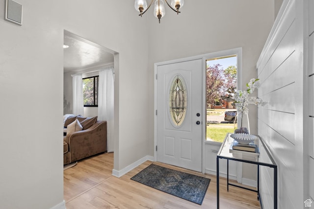 2111 W 5800 S, Roy, UT 84067 - entrance foyer featuring a chandelier, wood finished floors, and a towering ceiling