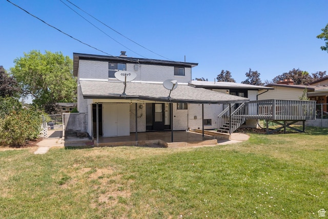 2111 W 5800 S, Roy, UT 84067 - back of house with a gate, brick siding, a wooden deck, and a patio area