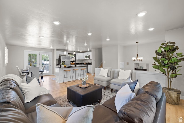 2111 W 5800 S, Roy, UT 84067 - living room featuring light wood-style flooring, recessed lighting, and a chandelier