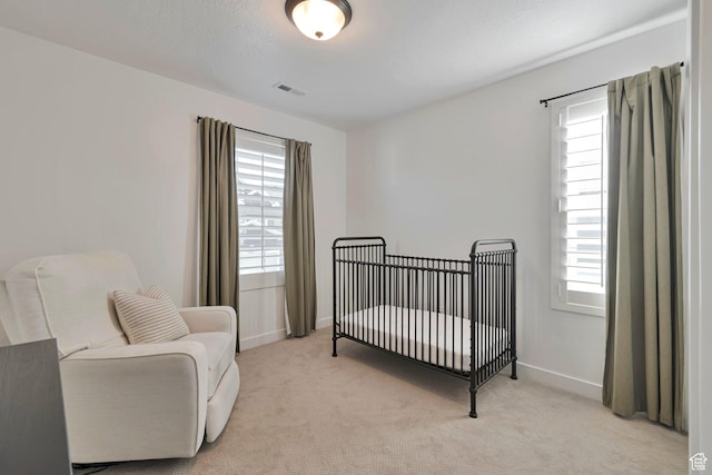 6427 W Arranmore Dr, South Jordan, UT 84009 - bedroom with multiple windows, light colored carpet, and a crib