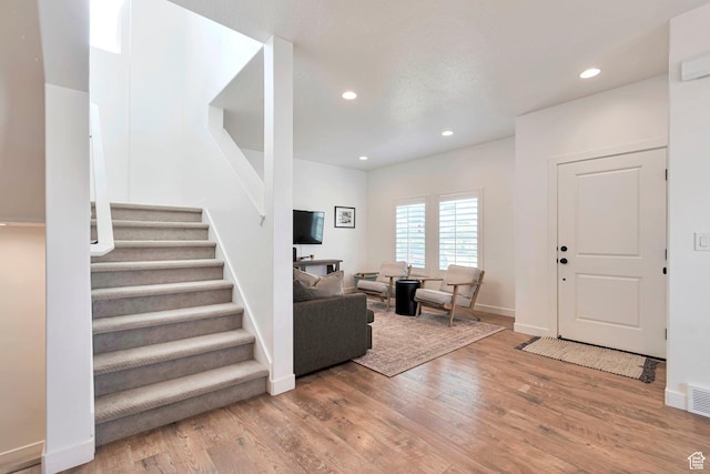 6427 W Arranmore Dr, South Jordan, UT 84009 - entryway with wood finished floors, stairs, and recessed lighting