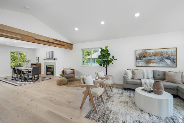 2038 W 8970 S, West Jordan, UT 84088 - living room with light wood-type flooring, vaulted ceiling, recessed lighting, plenty of natural light, and a glass covered fireplace