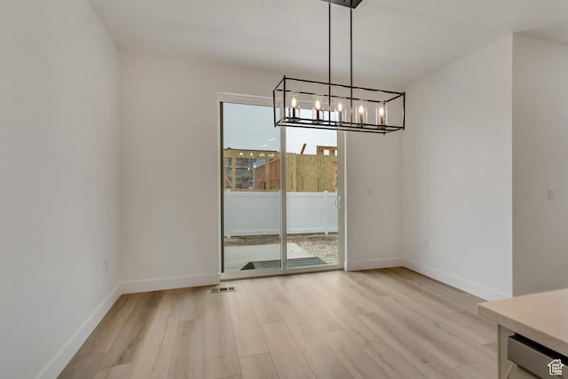 1274 N 1475 E Unit 37, Payson, UT 84651 - unfurnished dining area with light wood-style flooring and a chandelier
