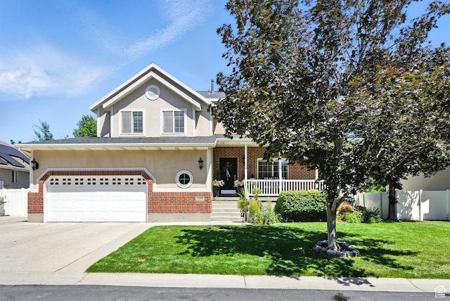 11803 Burkwood Ln, Draper, UT 84020 - traditional-style home with brick siding, concrete driveway, stucco siding, a garage, and a porch