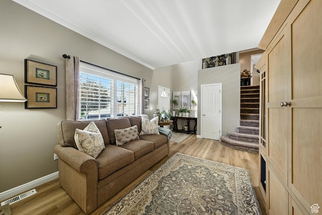11803 Burkwood Ln, Draper, UT 84020 - living area featuring light wood finished floors, stairs, and crown molding