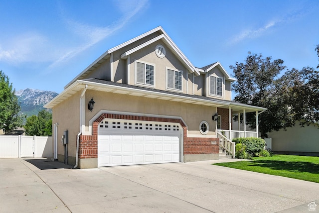 11803 Burkwood Ln, Draper, UT 84020 - traditional home featuring brick siding, driveway, stucco siding, and an attached garage