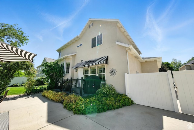11803 Burkwood Ln, Draper, UT 84020 - view of front of house featuring a gate and stucco siding