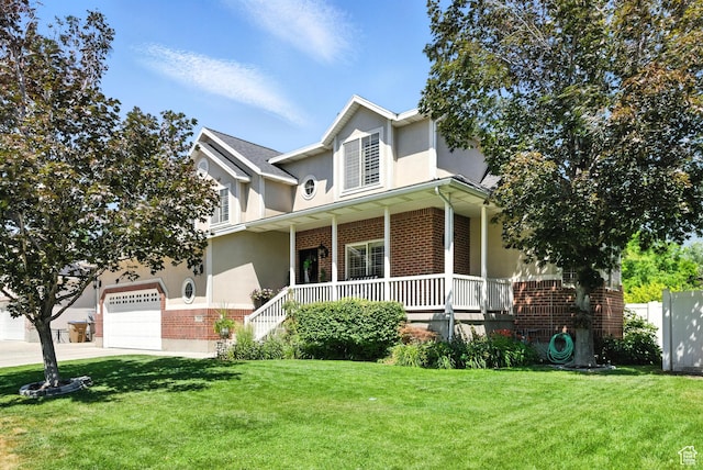 11803 Burkwood Ln, Draper, UT 84020 - traditional home with brick siding, covered porch, stucco siding, a front yard, and a garage