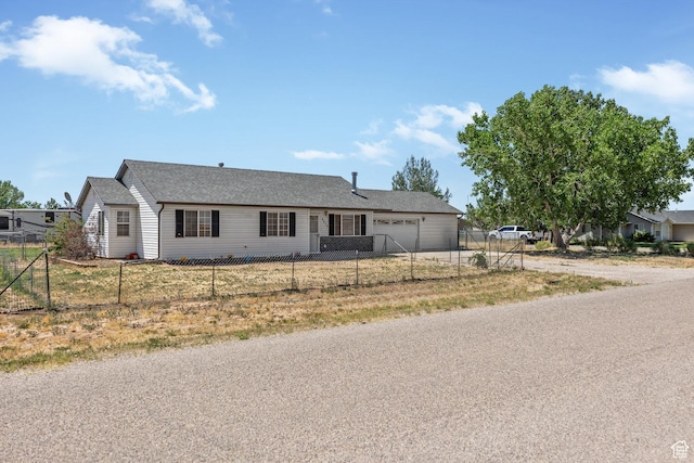 5317 N 2700 W, Cedar City, UT 84721 - ranch-style home with an attached garage, driveway, and roof with shingles