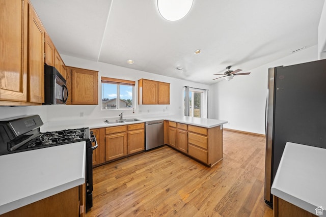 5317 N 2700 W, Cedar City, UT 84721 - kitchen featuring black appliances, lofted ceiling, a peninsula, light wood-type flooring, and a ceiling fan