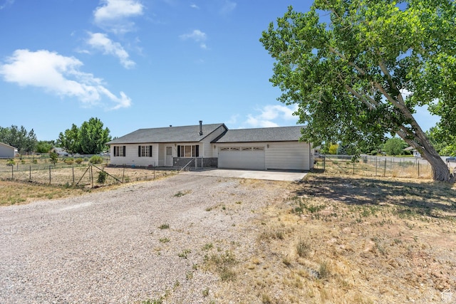 5317 N 2700 W, Cedar City, UT 84721 - ranch-style house with dirt driveway and an attached garage